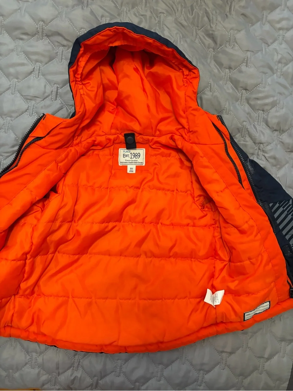 The Children's Place Navy Puffer Jacket with Bright Orange Lining